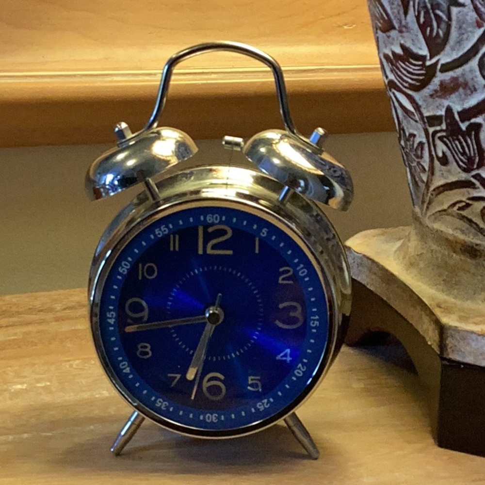 Three Hands Corp battery operated old school alarm clock.  Silver finish.